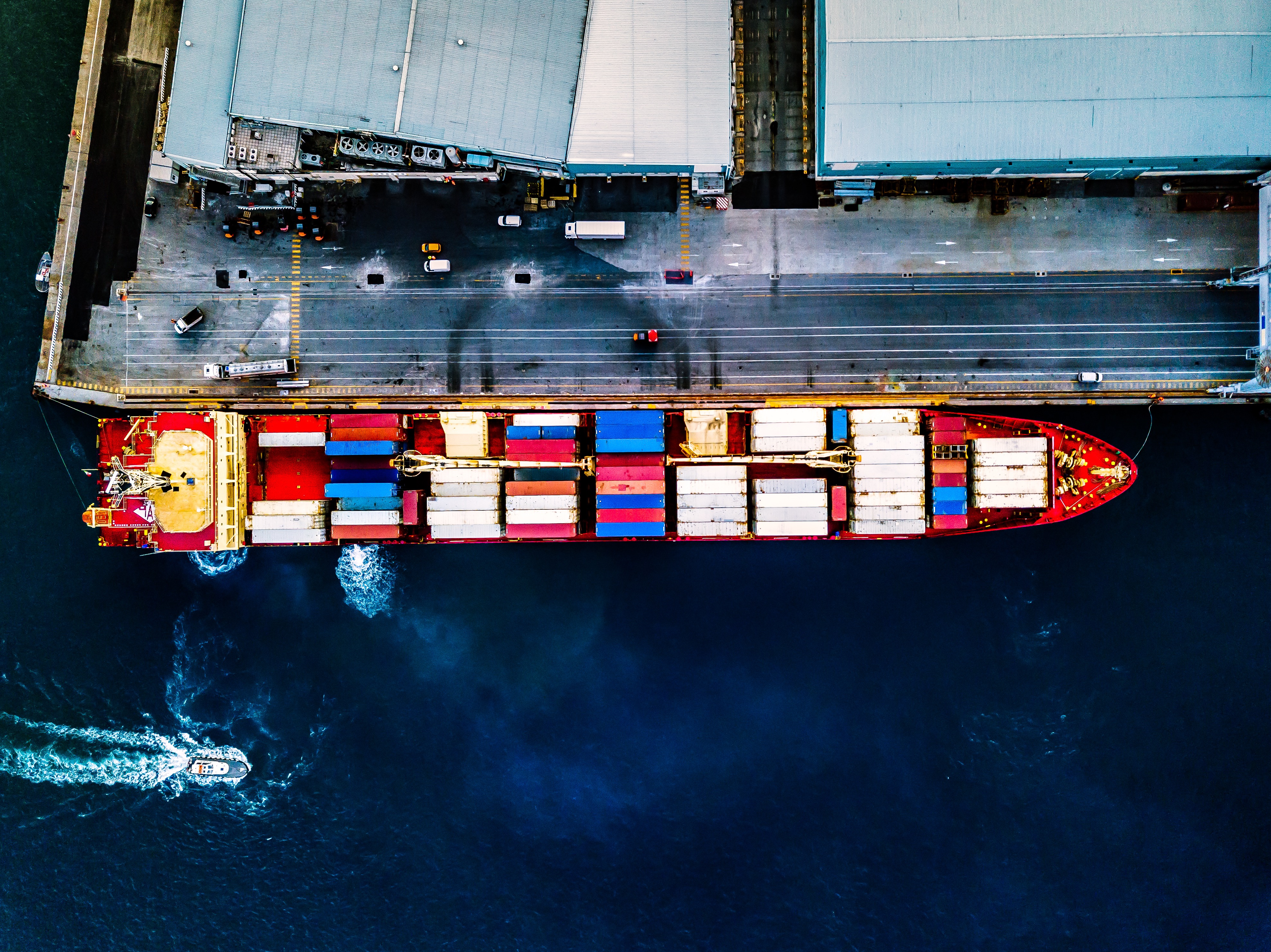 Aerial top view of container ship at sea port
